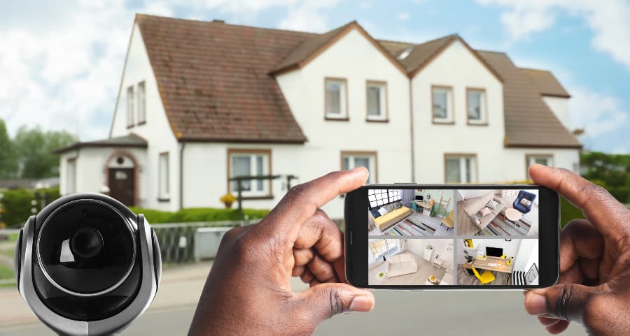 Man holding phone and checking streams from video cameras